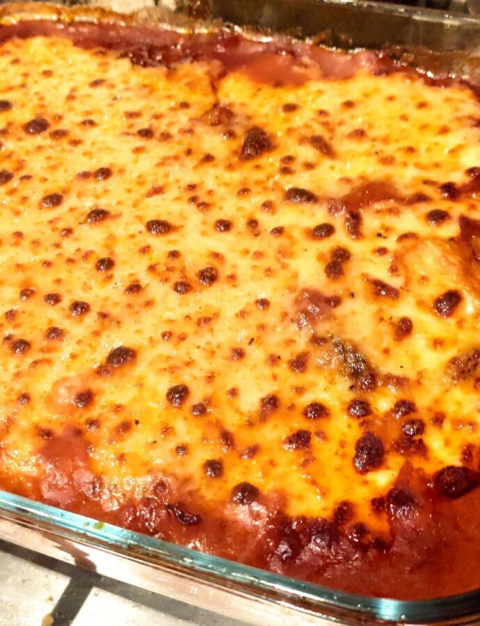 Oven baked aubergine, tomato & sheep&apos;s cheese bechamel