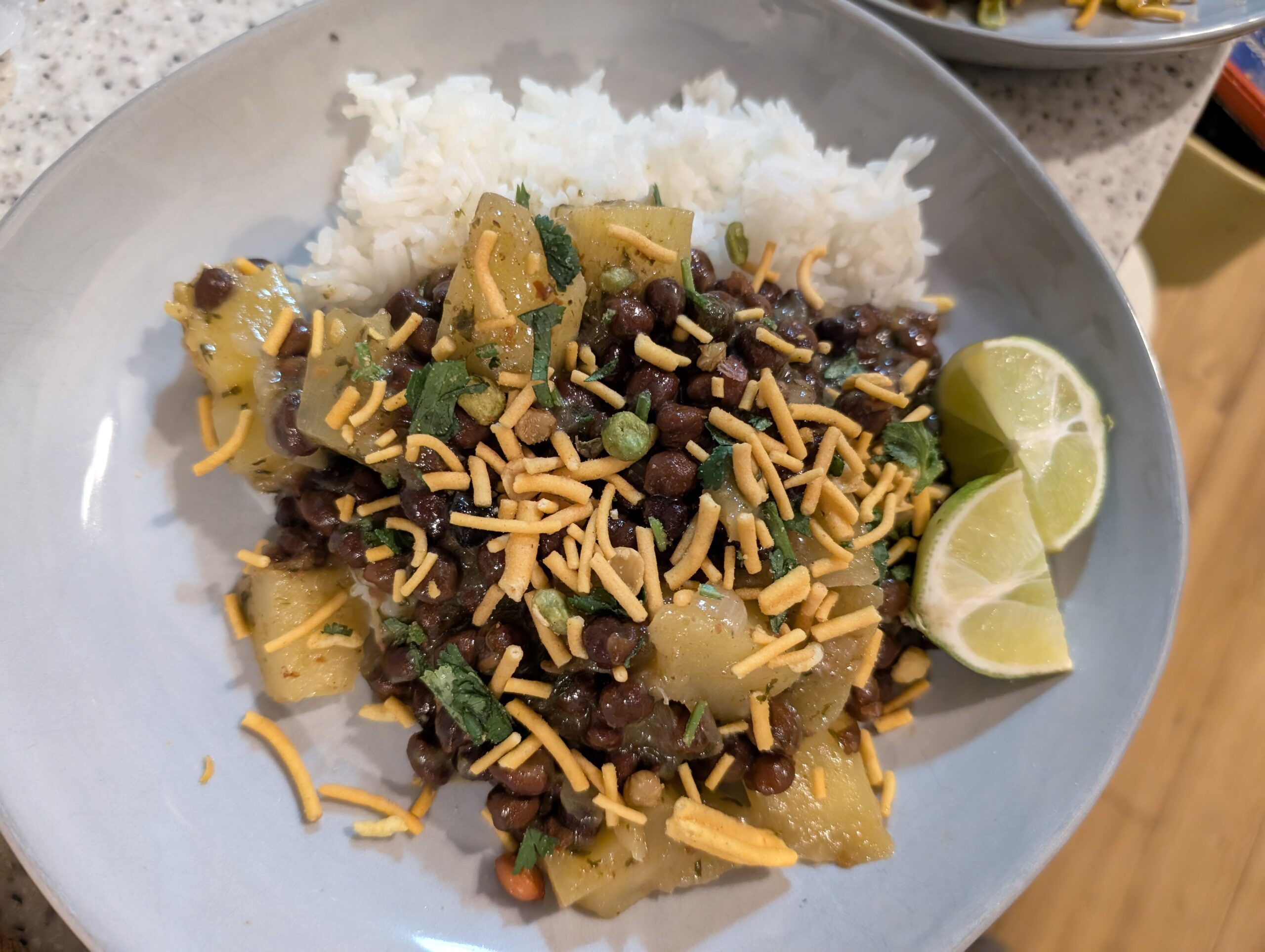 Black chickpea and mango curry with bombay mix